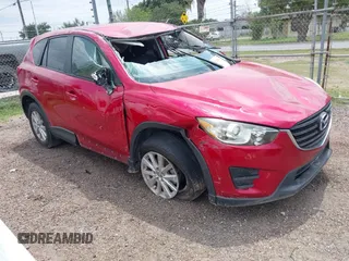 2016 Mazda CX-5 Sport with VIN JM3KE2BYXG0668401, listed as a IAAI auction lot 42370910 with Not provided miles and . Bid and sale history available at DreamBid. Image 1.