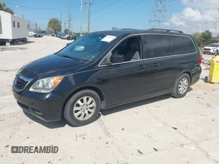 2010 Honda Odyssey EX-L with VIN 5FNRL3H79AB028724, listed as a IAAI auction lot 41687998 with 221,852 mi miles. Bid and sale history available at carsss.com. Image 2.