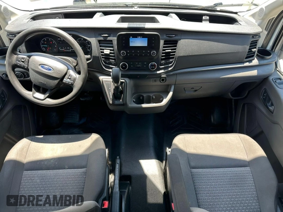2020 Ford Transit Cargo z VIN 1FTBR1CG3LKB36452, wystawiony jako Copart lot #58659545 z przebiegiem 171 504 mil mil oraz Tytuł czysty. Historia ofert i sprzedaży dostępna na DreamBid. Obrazek 9.