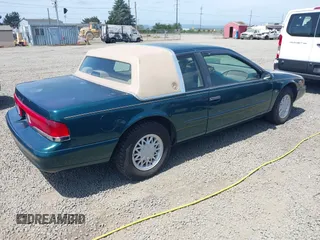 1995 Mercury Cougar z VIN 1MELM62W5SH606001, wystawiony jako IAAI lot #42461451 z przebiegiem 83 279 mil mil oraz . Historia ofert i sprzedaży dostępna na DreamBid. Obrazek 4.