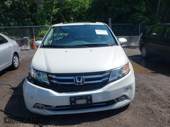 2014 Honda Odyssey Touring with VIN 5FNRL5H94EB071788, listed as a IAAI auction lot 42523959 with 244,734 mi miles and . Bid and sale history available at DreamBid. Image 12.