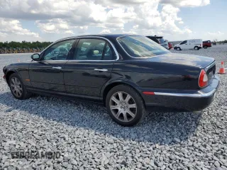 2004 Jaguar XJ with VIN SAJEA71C14SG10928, listed as a Copart auction lot 51202785 with 164,300 mi miles and Salvage Title. Bid and sale history available at carsss.com. Image 2.