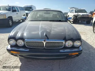 1999 Jaguar XJ with VIN SAJKX6049XC853940, listed as a Copart auction lot 74581244 with 0 mi miles and Salvage Title. Bid and sale history available at carsss.com. Image 5.