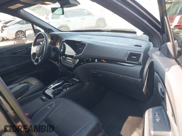 2023 Honda Passport Elite z VIN 5FNYF8H01PB005725, wystawiony jako IAAI lot #41457435 z przebiegiem 39 562 mil mil oraz . Historia ofert i sprzedaży dostępna na DreamBid. Obrazek 5.