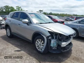 2014 Mazda CX-5 Touring with VIN JM3KE2CY4E0357445, listed as a IAAI auction lot 41967334 with 115,535 mi miles. Bid and sale history available at carsss.com. Image 1.