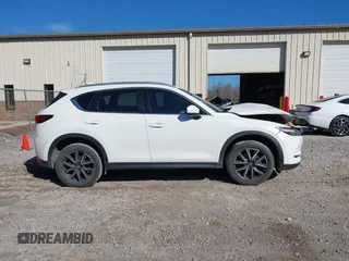 2018 Mazda CX-5 Grand Touring with VIN JM3KFADM0J0377026, listed as a IAAI auction lot 41649686 with 100,901 mi miles and . Bid and sale history available at DreamBid. Image 13.