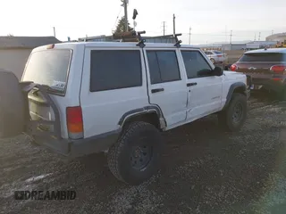 2000 Jeep Cherokee z VIN 1J4FF28P6YL132738, wystawiony jako IAAI lot #41382855 z przebiegiem 196 213 mil mil oraz . Historia ofert i sprzedaży dostępna na DreamBid. Obrazek 4.