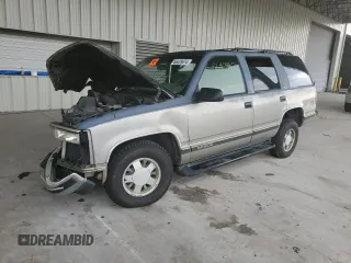 1999 GMC Yukon with VIN 1GKEC13R4XJ735246, listed as a Copart auction lot 56429874 with 258,616 mi miles and Salvage Title. Bid and sale history available at carsss.com. Image 1.
