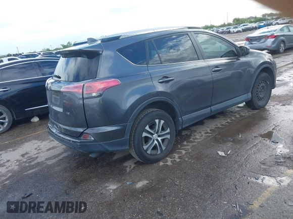 2016 Toyota RAV4 LE with VIN JTMZFREV5GJ097330, listed as a IAAI auction lot 41884397 with 107,699 mi miles. Bid and sale history available at carsss.com. Image 4.