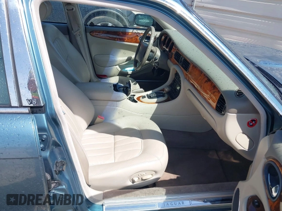 1998 Jaguar XJ with VIN SAJHX1241WC819418, listed as a IAAI auction lot 42456539 with 126,457 mi miles and . Bid and sale history available at DreamBid. Image 5.