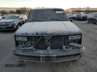 1999 Chevrolet Tahoe with VIN 3GNEC18R1XG143882, listed as a Copart auction lot 42177005 with 130,368 mi miles and Salvage title. Bid and sale history available at DreamBid. Image 5.