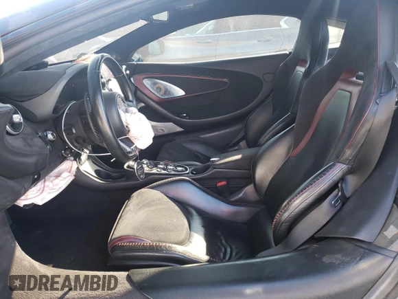 2021 McLaren GT z VIN SBM22GCA8MW001374, wystawiony jako Copart lot #82147064 z przebiegiem 32 562 mil mil oraz Nie do naprawy. Historia ofert i sprzedaży dostępna na DreamBid. Obrazek 7.