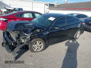 2016 Kia Optima LX with VIN 5XXGT4L31GG022844, listed as a IAAI auction lot 41240100 with 121,586 mi miles and . Bid and sale history available at DreamBid. Image 2.