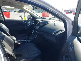 2013 Ford Escape Titanium with VIN 1FMCU0J96DUA71857, listed as a IAAI auction lot 41877003 with 118,864 mi miles and . Bid and sale history available at carsss.com. Image 5.