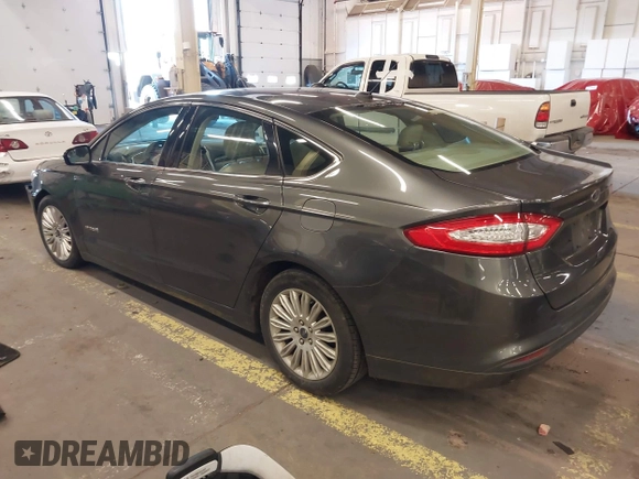 2016 Ford Fusion SE Hybrid with VIN 3FA6P0LU9GR235291, listed as a IAAI auction lot 41560312 with 112,777 mi miles. Bid and sale history available at carsss.com. Image 3.
