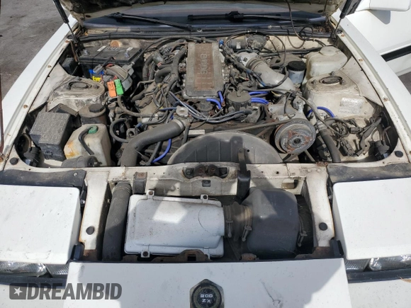 1985 Nissan 300ZX z VIN JN1HZ16S9FX050874, wystawiony jako Copart lot #72283704 z przebiegiem 139 895 mil mil oraz Tytuł czysty. Historia ofert i sprzedaży dostępna na DreamBid. Obrazek 11.