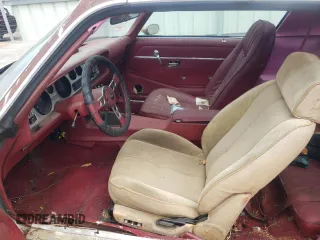 1979 Pontiac Firebird z VIN 2V8729L171075, wystawiony jako Copart lot #65532655 z przebiegiem 17 594 mil mil oraz Czysty tytuł • Clean title. Historia ofert i sprzedaży dostępna na DreamBid. Obrazek 7.