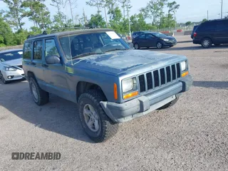 1999 Jeep Cherokee Sport z VIN 1J4FT68S9XL581835, wystawiony jako IAAI lot #42499071 z przebiegiem 203 782 mil mil oraz . Historia ofert i sprzedaży dostępna na DreamBid. Obrazek 1.