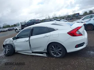 2019 Honda Civic EX-L z VIN 19XFC1F70KE202584, wystawiony jako IAAI lot #41727976 z przebiegiem 67 891 mil mil oraz . Historia ofert i sprzedaży dostępna na DreamBid. Obrazek 14.