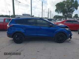 2018 Ford Escape SE z VIN 1FMCU0GD2JUC27271, wystawiony jako IAAI lot #41947047 z przebiegiem 154 672 mil mil oraz . Historia ofert i sprzedaży dostępna na DreamBid. Obrazek 13.