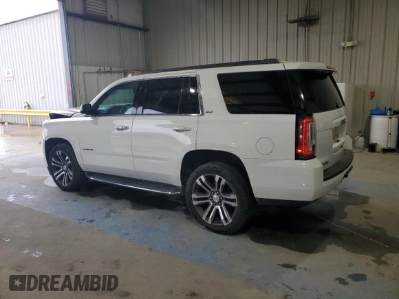 2016 GMC Yukon SLT with VIN 1GKS1BKC5GR450147, listed as a Copart auction lot 51058805 with 163,944 mi miles and Salvage Title. Bid and sale history available at carsss.com. Image 2.