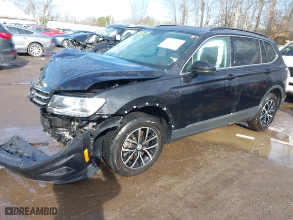 2021 Volkswagen Tiguan SE with VIN 3VV2B7AX7MM050891, listed as a IAAI auction lot 41519674 with 43,318 mi miles. Bid and sale history available at carsss.com. Image 2.