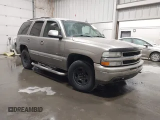 2003 Chevrolet Tahoe LS z VIN 1GNEK13T33J184349, wystawiony jako IAAI lot #41871231 z przebiegiem 238 166 mil mil oraz . Historia ofert i sprzedaży dostępna na DreamBid. Obrazek 1.