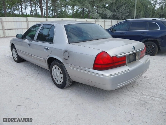 2004 Mercury Grand Marquis GS with VIN 2MEFM74W04X669087, listed as a IAAI auction lot 42090394 with 172,008 mi miles. Bid and sale history available at carsss.com. Image 3.