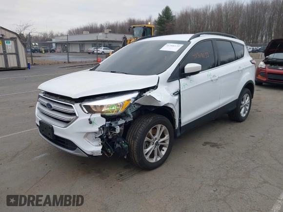 2018 Ford Escape SE z VIN 1FMCU9GD2JUC77186, wystawiony jako IAAI lot #41308133 z przebiegiem 123 156 mil mil oraz . Historia ofert i sprzedaży dostępna na DreamBid. Obrazek 17.