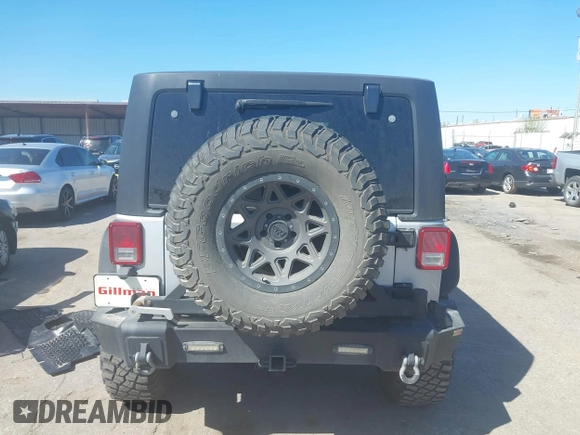 2012 Jeep Wrangler Unlimited Sport with VIN 1C4BJWDG8CL270788, listed as a IAAI auction lot 41758929 with 138,935 mi miles. Bid and sale history available at carsss.com. Image 16.
