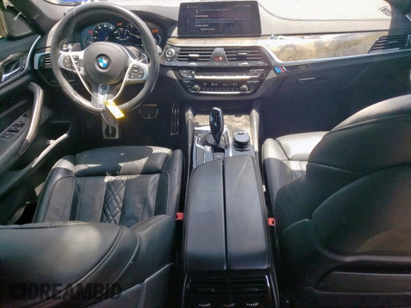 2018 BMW 5 Series M550i xDrive with VIN WBAJB9C54JB286450, listed as a Copart auction lot 61232125 with 88,479 mi miles and Salvage title. Bid and sale history available at DreamBid. Image 8.
