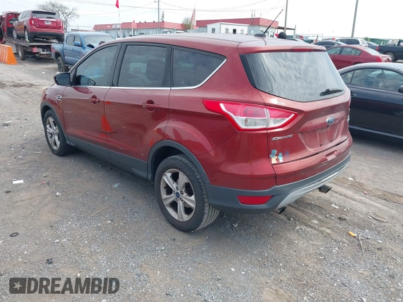 2014 Ford Escape SE with VIN 1FMCU0GX2EUB60526, listed as a IAAI auction lot 42060469 with 128,796 mi miles. Bid and sale history available at carsss.com. Image 3.