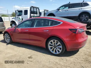 2018 Tesla Model 3 Long Range Battery z VIN 5YJ3E1EA4JF061733, wystawiony jako Copart lot #54885335 z przebiegiem 84 700 mil mil oraz Szkoda całkowita • Salvage title. Historia ofert i sprzedaży dostępna na DreamBid. Obrazek 2.