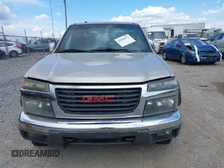 2009 GMC Canyon SLE1 z VIN 1GTDT13E398100890, wystawiony jako IAAI lot #42030572 z przebiegiem 160 181 mil mil oraz . Historia ofert i sprzedaży dostępna na DreamBid. Obrazek 12.
