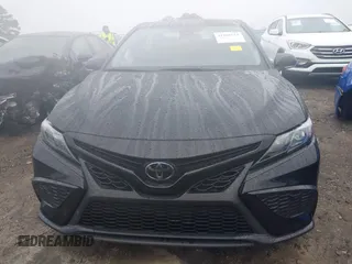 2023 Toyota Camry SE z VIN 4T1G11AK0PU809322, wystawiony jako IAAI lot #41056512 z przebiegiem 33 159 mil mil oraz . Historia ofert i sprzedaży dostępna na DreamBid. Obrazek 12.