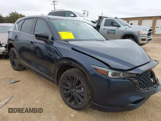 2022 Mazda CX-5 2.5 Turbo with VIN JM3KFBAY5N0521947, listed as a IAAI auction lot 41424202 with 43,961 mi miles and . Bid and sale history available at carsss.com. Image 1.