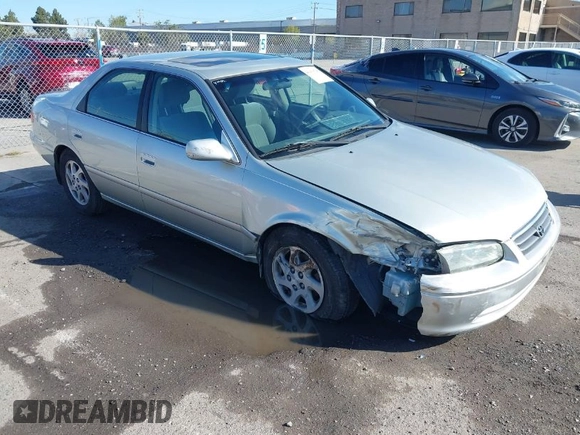 2001 Toyota Camry LE z VIN JT2BF22KX10342454, wystawiony jako IAAI lot #41939743 z przebiegiem 124 045 mil mil oraz . Historia ofert i sprzedaży dostępna na DreamBid. Obrazek 1.
