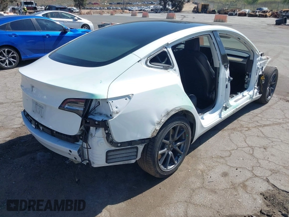2018 Tesla Model 3 Long Range Battery with VIN 5YJ3E1EAXJF108781, listed as a IAAI auction lot 41962628 with 61,208 mi miles and . Bid and sale history available at DreamBid. Image 4.