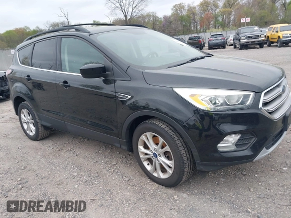 2017 Ford Escape SE with VIN 1FMCU9GD0HUC58128, listed as a IAAI auction lot 42078045 with 125,503 mi miles. Bid and sale history available at carsss.com. Image 1.