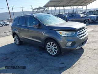 2018 Ford Escape Titanium with VIN 1FMCU0J98JUA03474, listed as a IAAI auction lot 37677880 with 106,423 mi miles and . Bid and sale history available at DreamBid. Image 1.