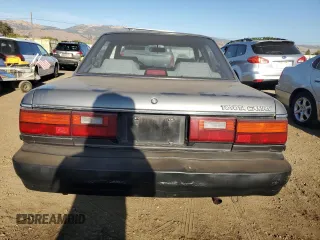 1989 Toyota Camry z VIN JT2SV21E8K0314703, wystawiony jako Copart lot #76053194 z przebiegiem 124 873 mil mil oraz Nie do naprawy • Non repairable. Historia ofert i sprzedaży dostępna na DreamBid. Obrazek 6.