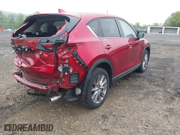 2020 Mazda CX-5 Grand Touring with VIN JM3KFBDM7L1731837, listed as a IAAI auction lot 42160795 with 63,826 mi miles and . Bid and sale history available at DreamBid. Image 4.