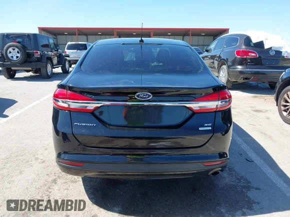 2017 Ford Fusion SE z VIN 3FA6P0HD1HR138693, wystawiony jako IAAI lot #41837634 z przebiegiem 117 638 mil mil oraz . Historia ofert i sprzedaży dostępna na DreamBid. Obrazek 16.