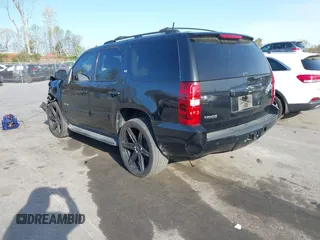 2014 Chevrolet Tahoe LT with VIN 1GNSCBE0XER202150, listed as a IAAI auction lot 41922771 with 168,693 mi miles and . Bid and sale history available at DreamBid. Image 3.