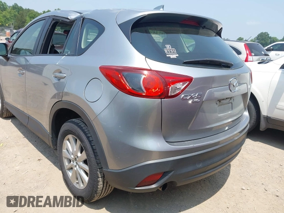 2014 Mazda CX-5 Sport with VIN JM3KE4BE9E0411177, listed as a IAAI auction lot 42411938 with 167,709 mi miles and . Bid and sale history available at DreamBid. Image 3.