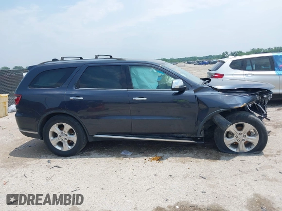 2014 Dodge Durango SXT with VIN 1C4RDHAG3EC560851, listed as a IAAI auction lot 42282572 with Not provided miles and . Bid and sale history available at DreamBid. Image 14.