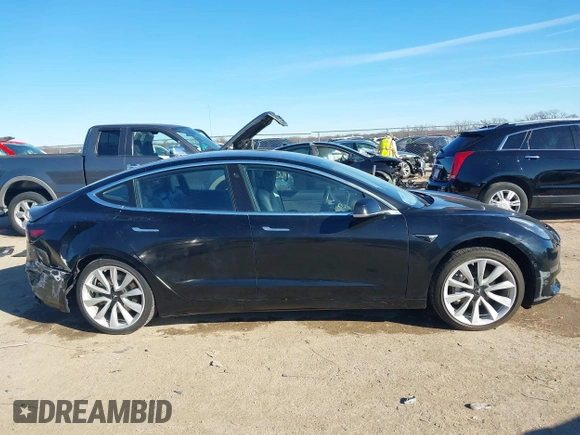2018 Tesla Model 3 Long Range Battery with VIN 5YJ3E1EA2JF014975, listed as a IAAI auction lot 41319407 with 106,301 mi miles and . Bid and sale history available at DreamBid. Image 13.