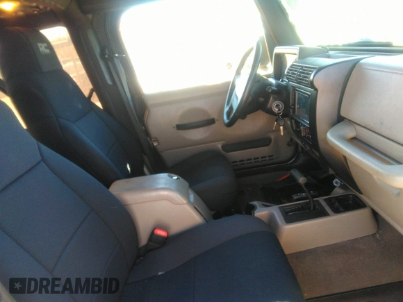 2003 Jeep Wrangler Sport with VIN 1J4FA49S53P365363, listed as a IAAI auction lot 41818320 with 154,567 mi miles. Bid and sale history available at carsss.com. Image 5.