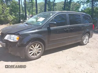 2014 Dodge Grand Caravan SXT with VIN 2C4RDGCG2ER313531, listed as a IAAI auction lot 42221726 with 177,065 mi miles and . Bid and sale history available at DreamBid. Image 2.
