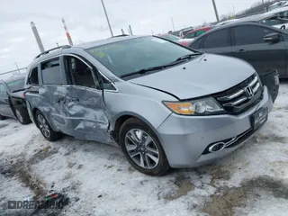 2016 Honda Odyssey Touring Elite with VIN 5FNRL5H93GB042768, listed as a IAAI auction lot 41350129 with 162,127 mi miles. Bid and sale history available at carsss.com. Image 1.